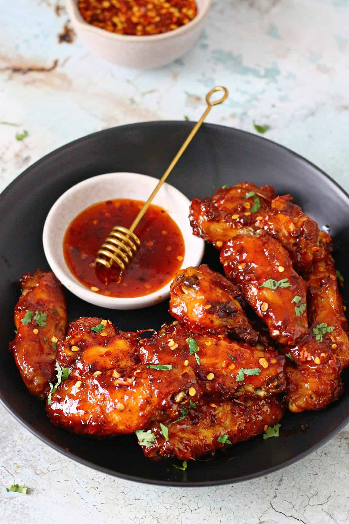 hot-honey-chicken-wings-with-sauce-and-chili-flakes